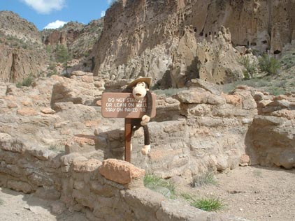 Do not stand or lean on walls. Stay on paved trail.